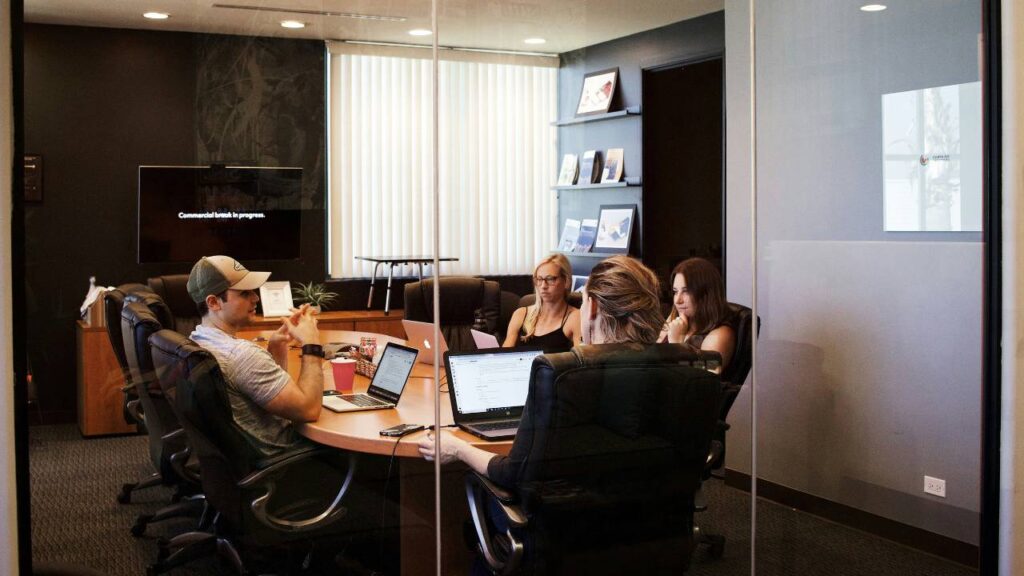 Several employees meeting in the conference room 